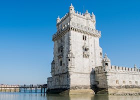 Capture of the historic Belem Tower against a clear blue sky in Lisbon, Portugal.